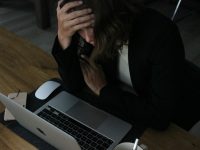 Photo by Elisa Ventur woman in black blazer sitting on chair